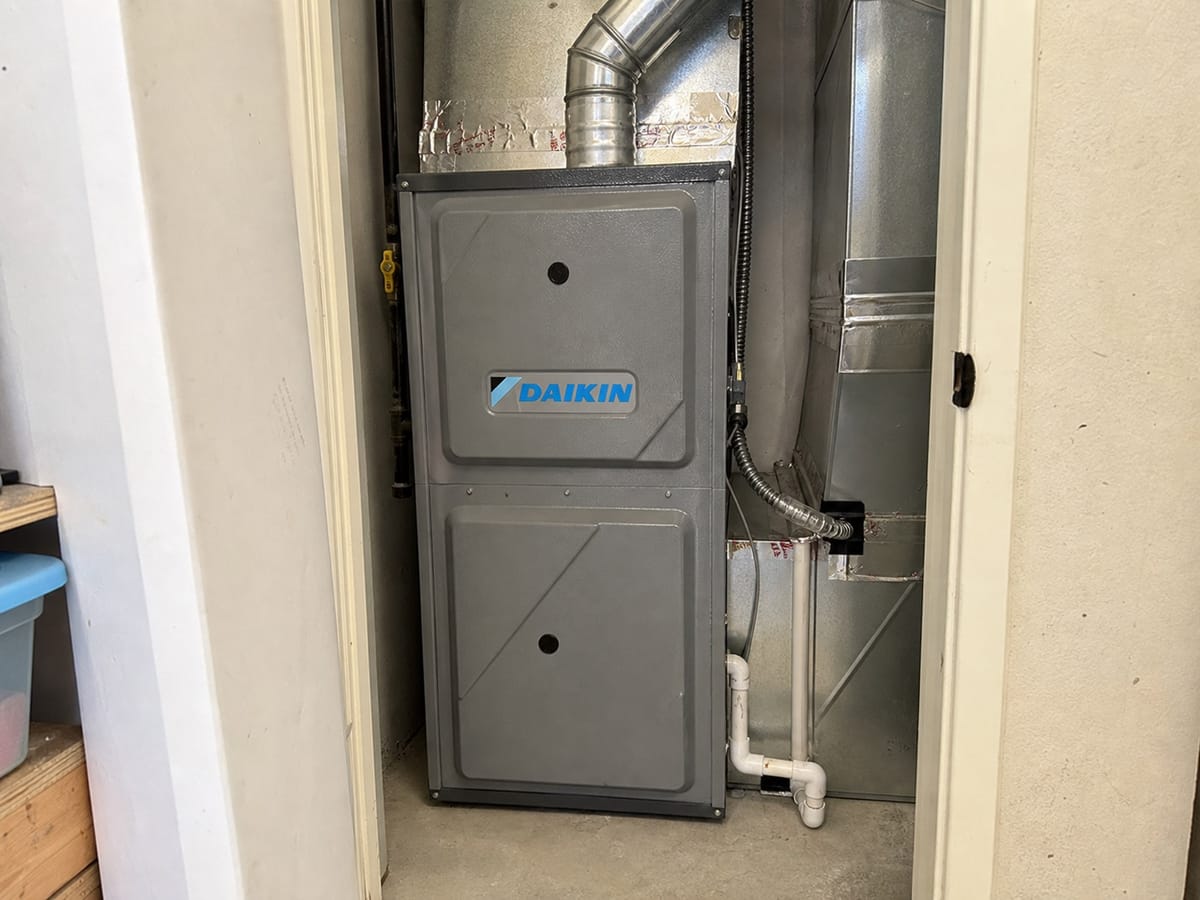 Furnace heating system installed in a utility closet